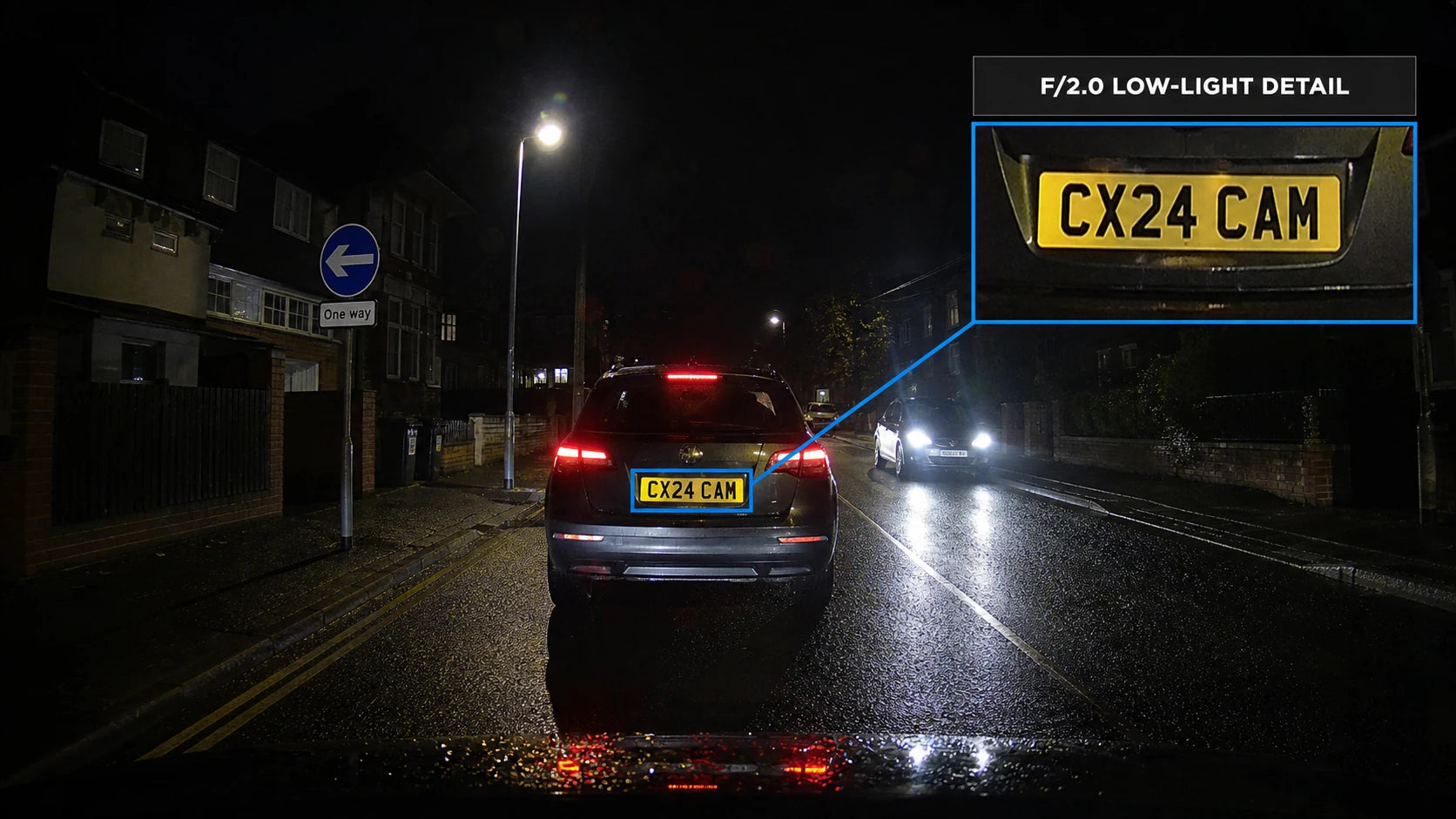 Low-light road recording with a nearby UK number plate highlighted